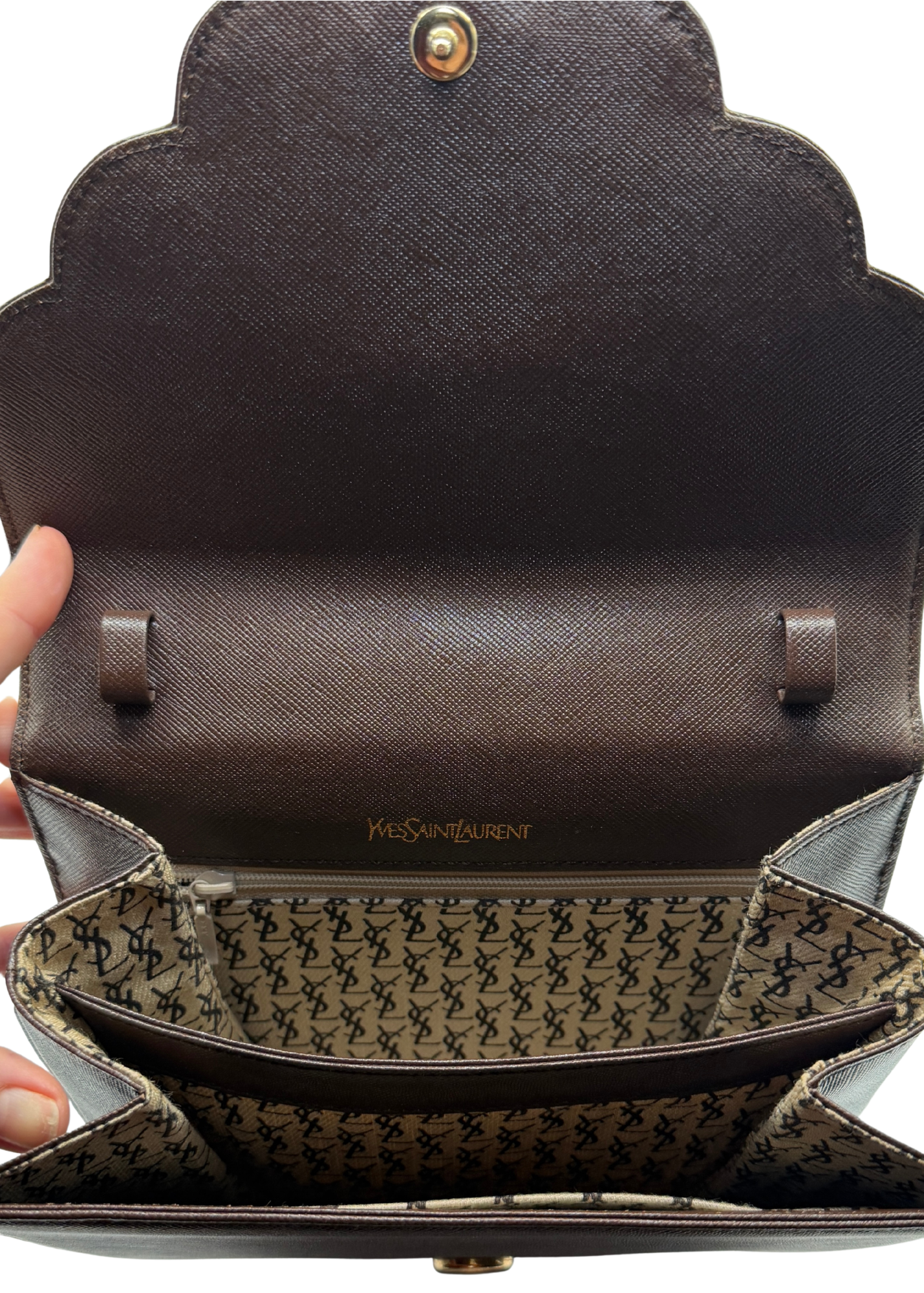 Interior of vintage Yves Saint Laurent crossbody brown bag Interior