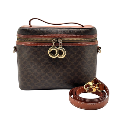 Brown vintage Celine leather bag with gold accents on a white background