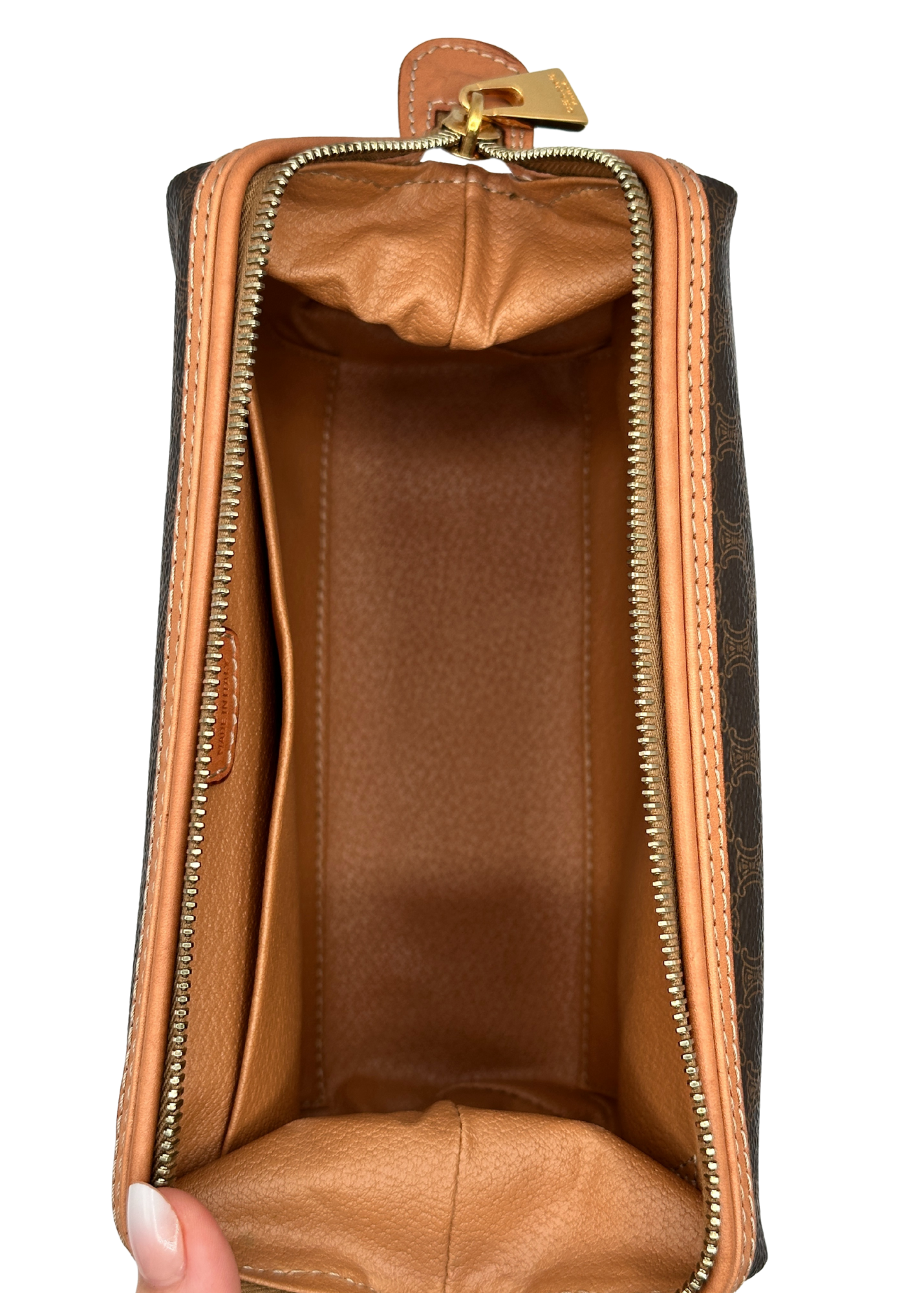 Brown leather Celine pouch with gold zipper on a white background