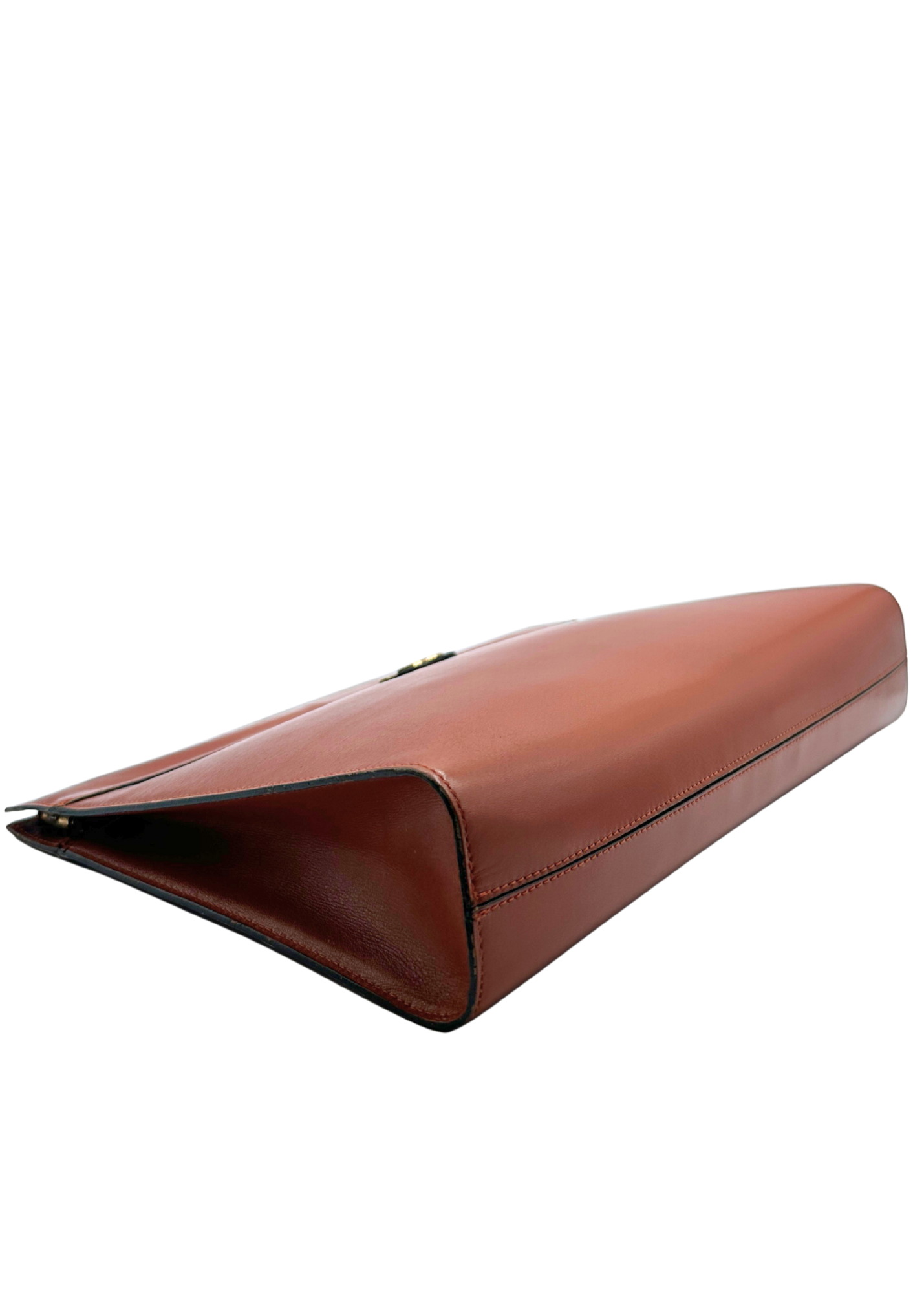 Brown leather Chanel clutch bag on a white background