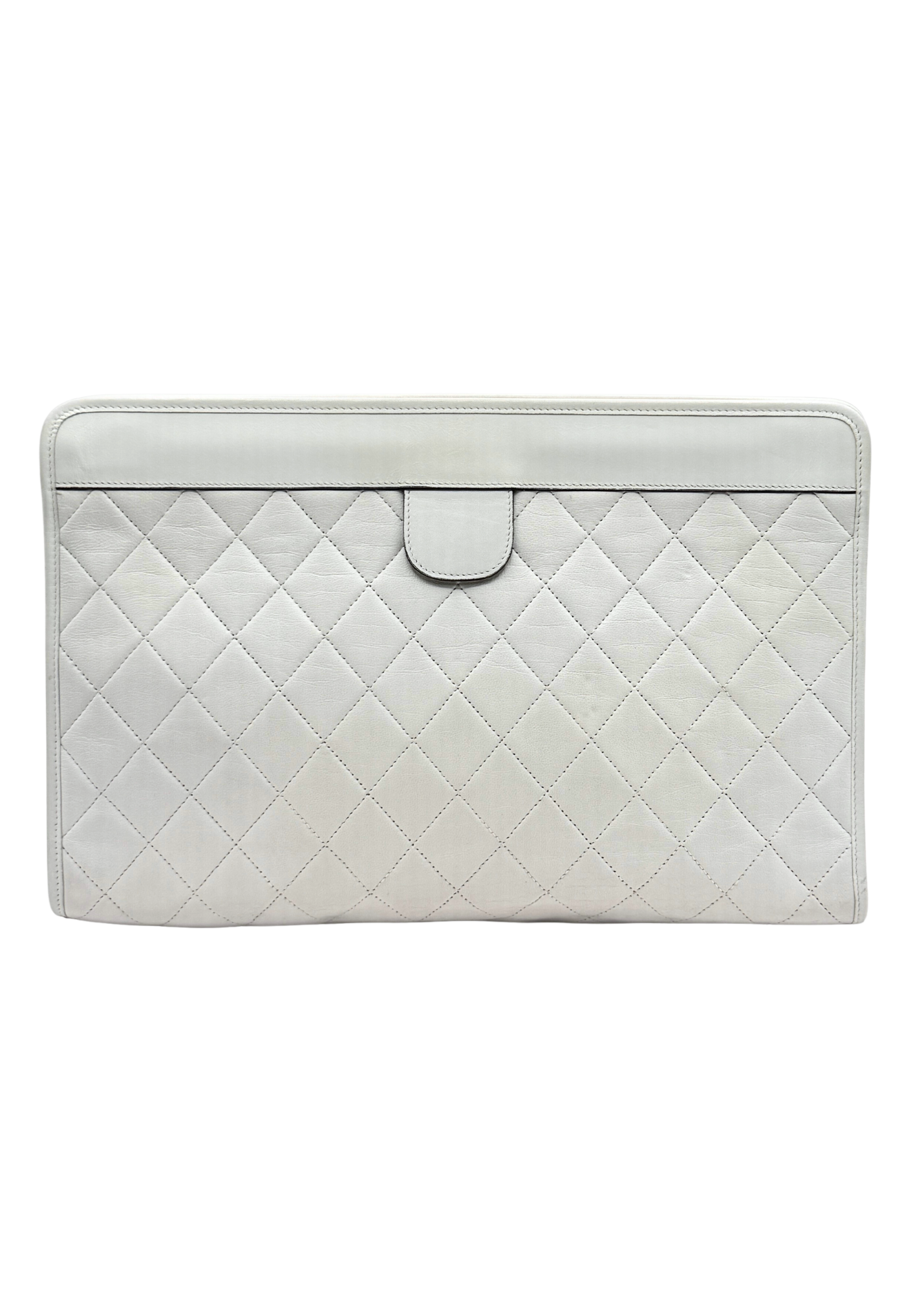 Quilted white vintage Chanel clutch bag on a white background