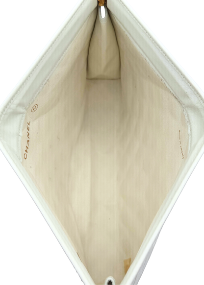 Close-up of a Chanel vintage clutch handbag interior with visible branding.