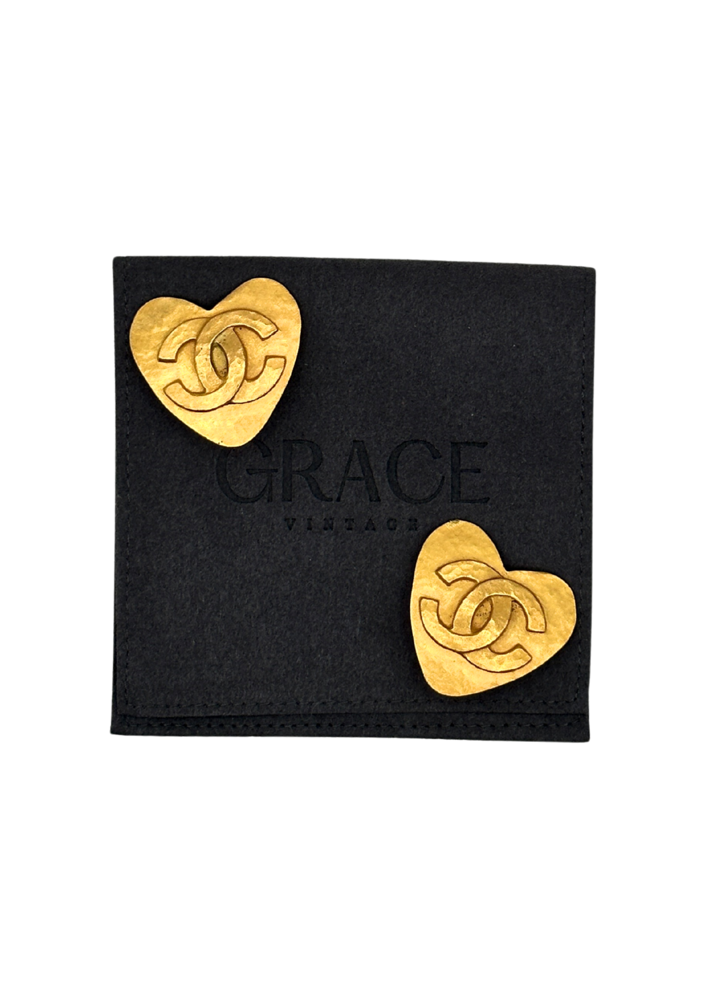 Gold heart-shaped vintage Chanel earrings on a black card with 'Grace Vintage' branding.
