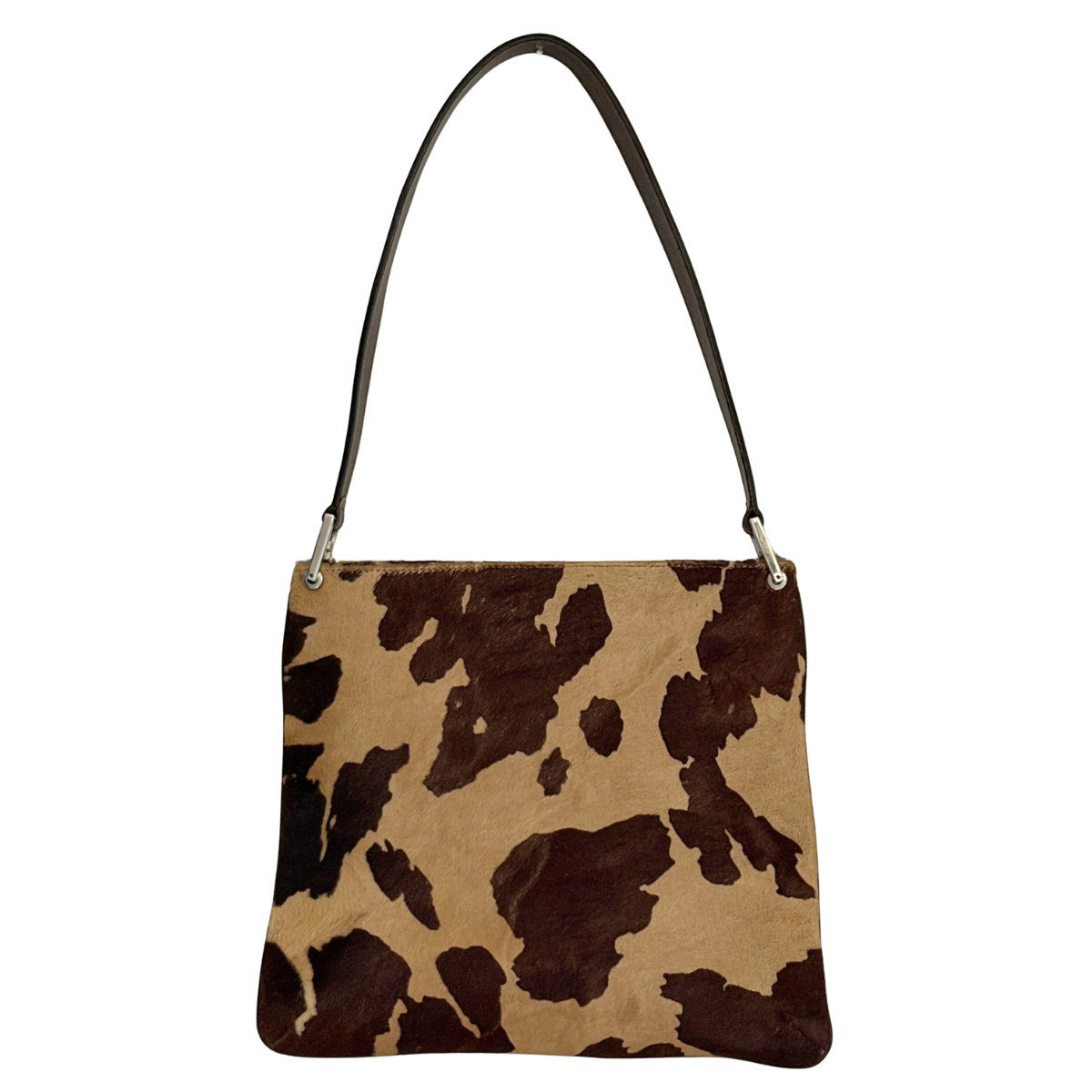 Cow print vintage Fendi handbag with a brown strap on a white background