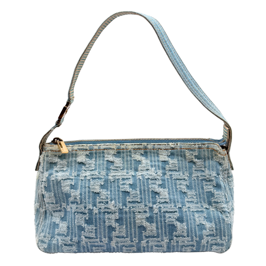 A light blue denim vintage Fendi shoulder bag with a distressed, frayed monogram pattern and a matching blue strap, shown against a plain white background.