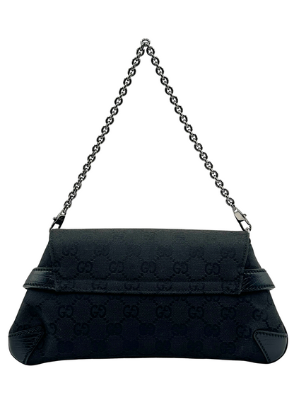 Black Gucci handbag with chain strap on a white background