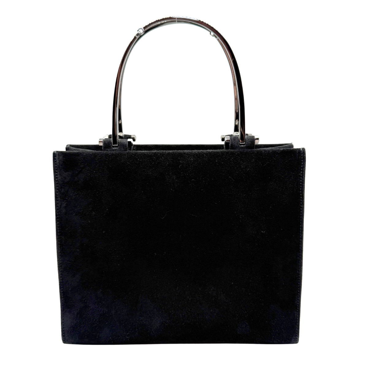 A black suede tote bag with a structured rectangular shape and a curved metallic silver horsebit handle, shown against a plain white background.