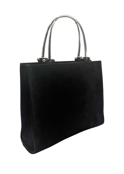 A black suede vintage Gucci tote bag with double silver metal top handles, shown from a three-quarter angle against a plain white background.