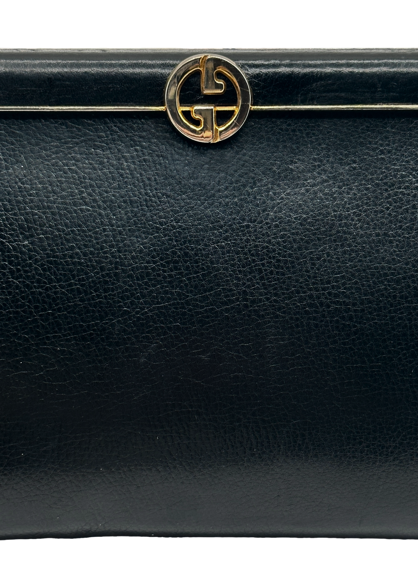 Black leather handbag with a gold Gucci GG logo on a white background