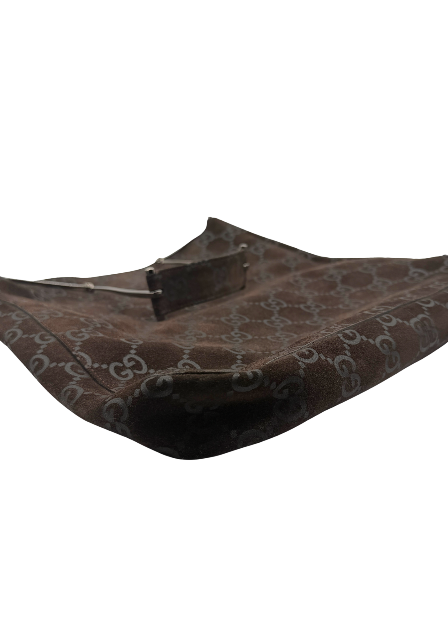 A brown Gucci shoulder bag made of the brand's signature GG monogram suede, shown on a plain white background.
