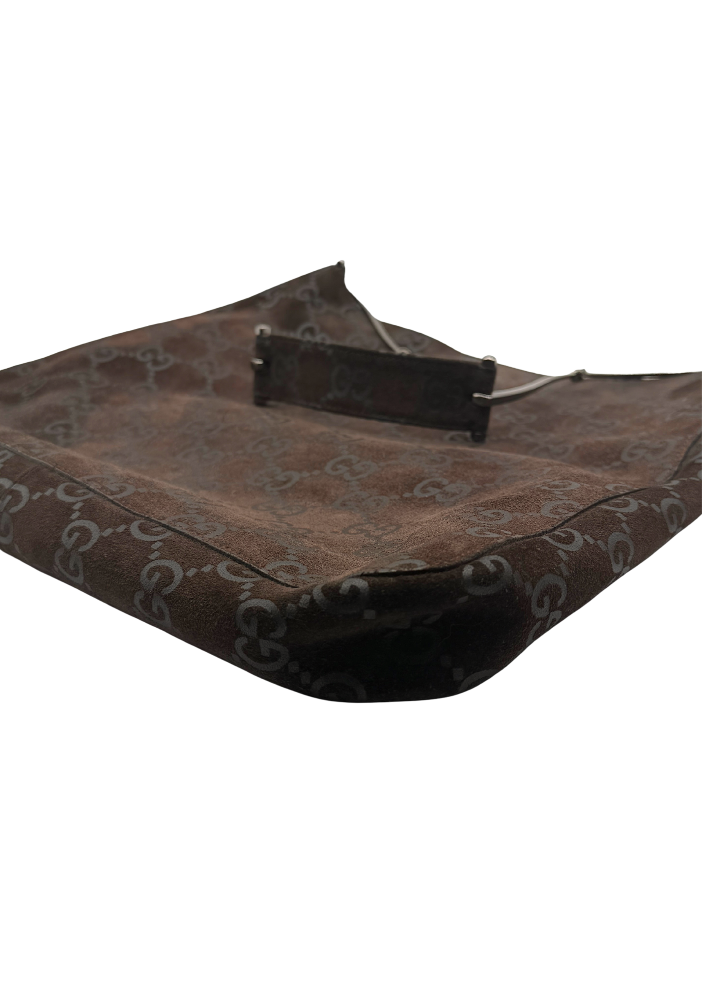 A brown suede monogram bag with a dark brown leather handle and horsebit shoulder strap, shown on a plain white background.