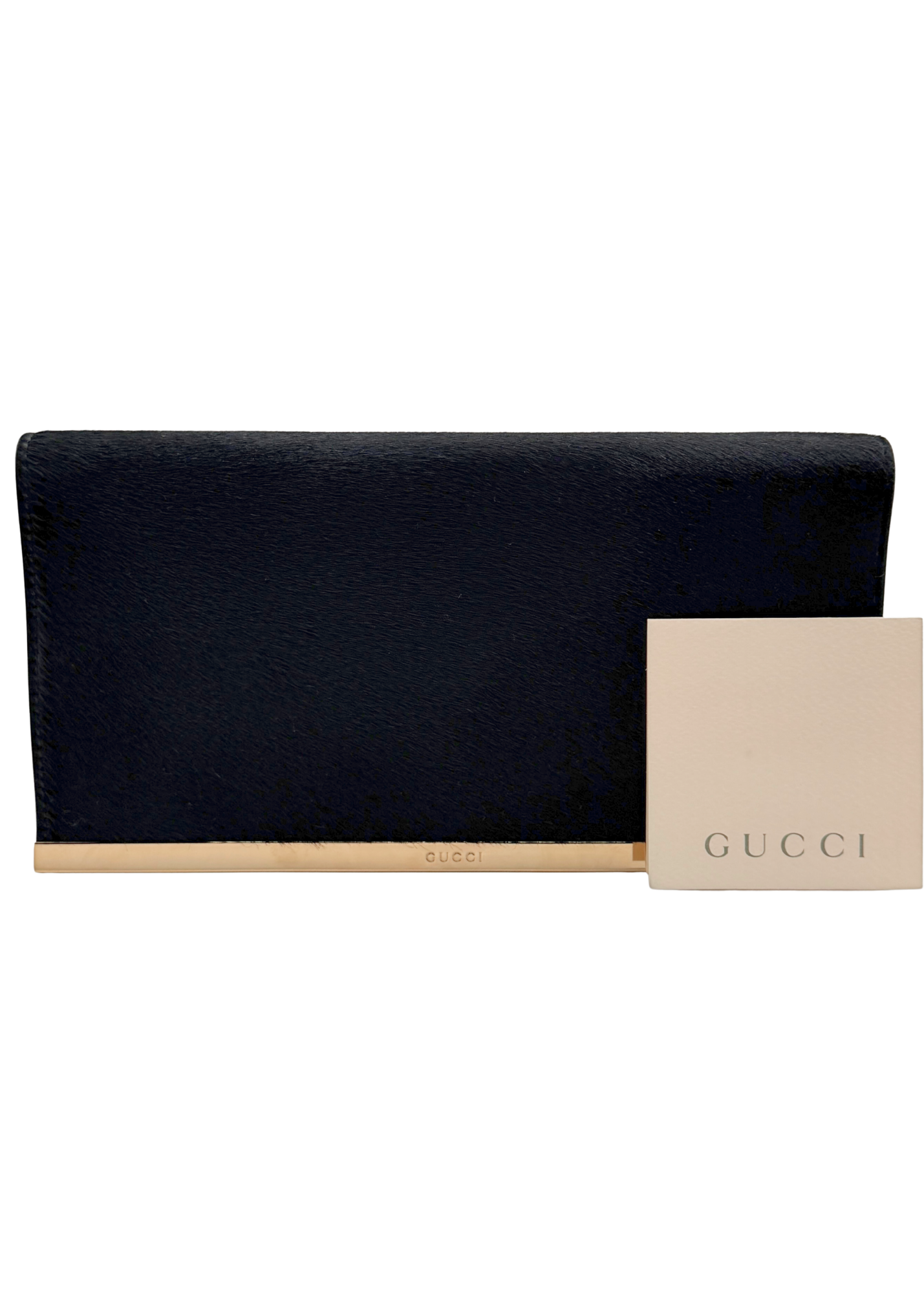 Black rare vintage clutch bag with a beige card featuring Gucci logo on a white background