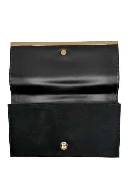 Gucci vintage black ponyhair clutch opened on a white background