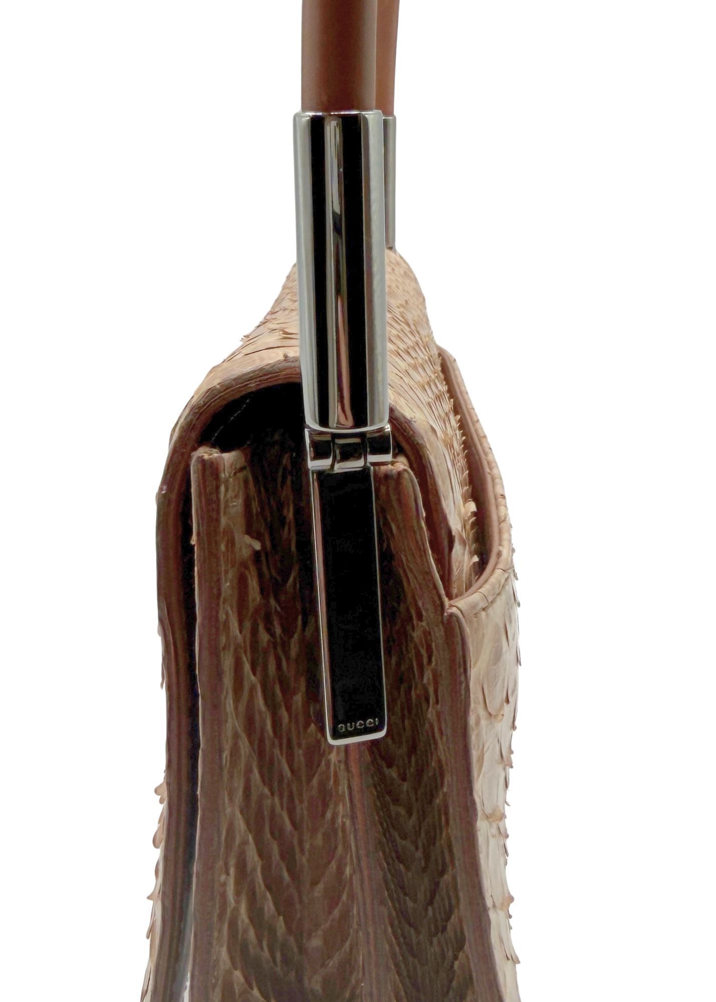 Close-up of a brown and tan vintage Gucci handbag with a metallic clasp on a white background
