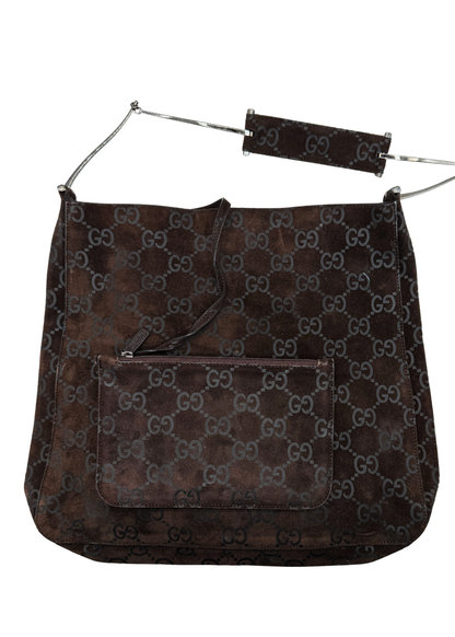 Brown Gucci vintage handbag with monogram pattern on a white background