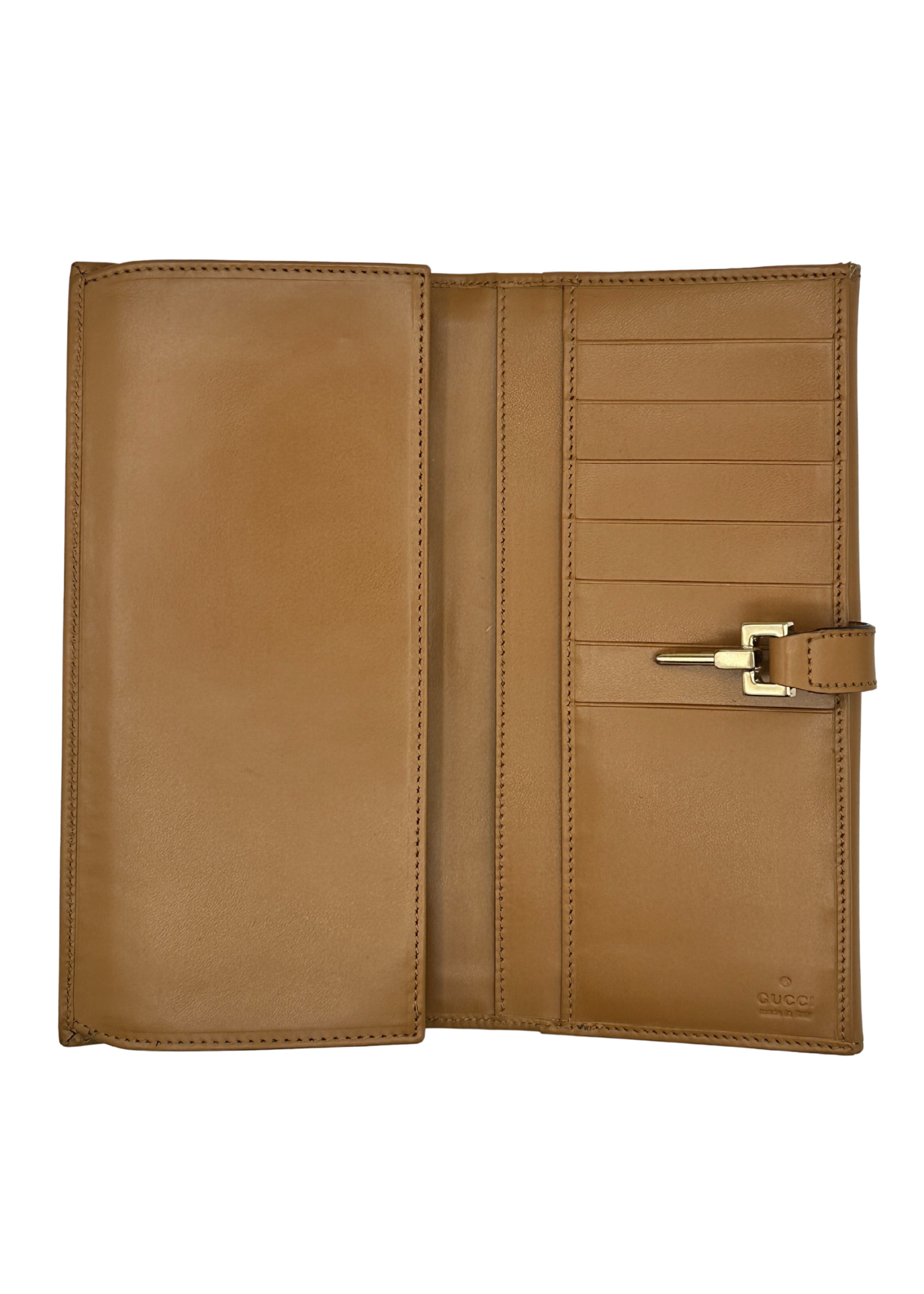 Brown Gucci leather wallet with gold buckle on a white background