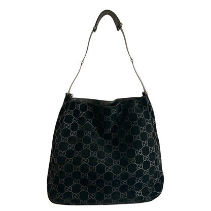 Black suede vintage handbag with Gucci GG pattern on a white background