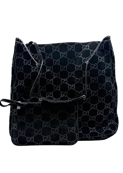 Black Gucci GG patterned suede bag on a white background