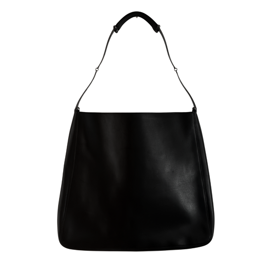 Black vintage Gucci handbag with a white interior on a white background