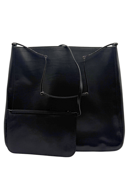 Black vintage Gucci leather handbag with a horsebit shoulder strap on a white background
