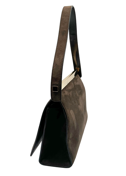 Brown leather handbag with a strap on a white background