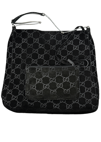 Black vintage Gucci handbag with monogram pattern on a white background