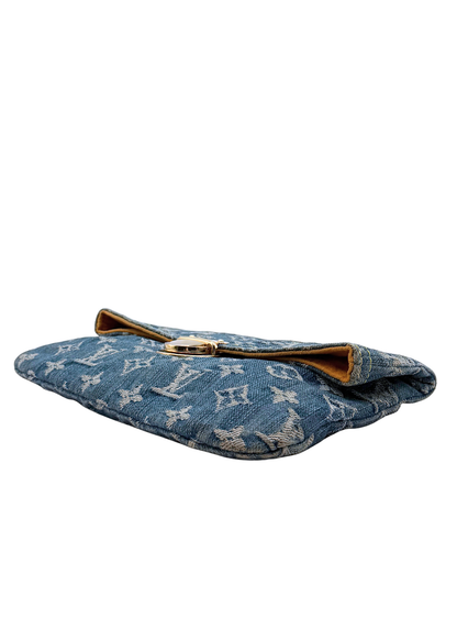 Vintage blue denim Louis Vuitton clutch with gold accents on a white background