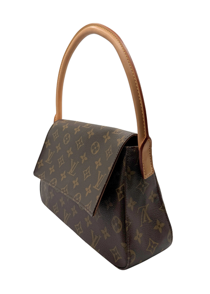 A vintage Louis Vuitton monogram shoulder bag in brown coated canvas with tan leather trim and handle, shown on a plain white background.
