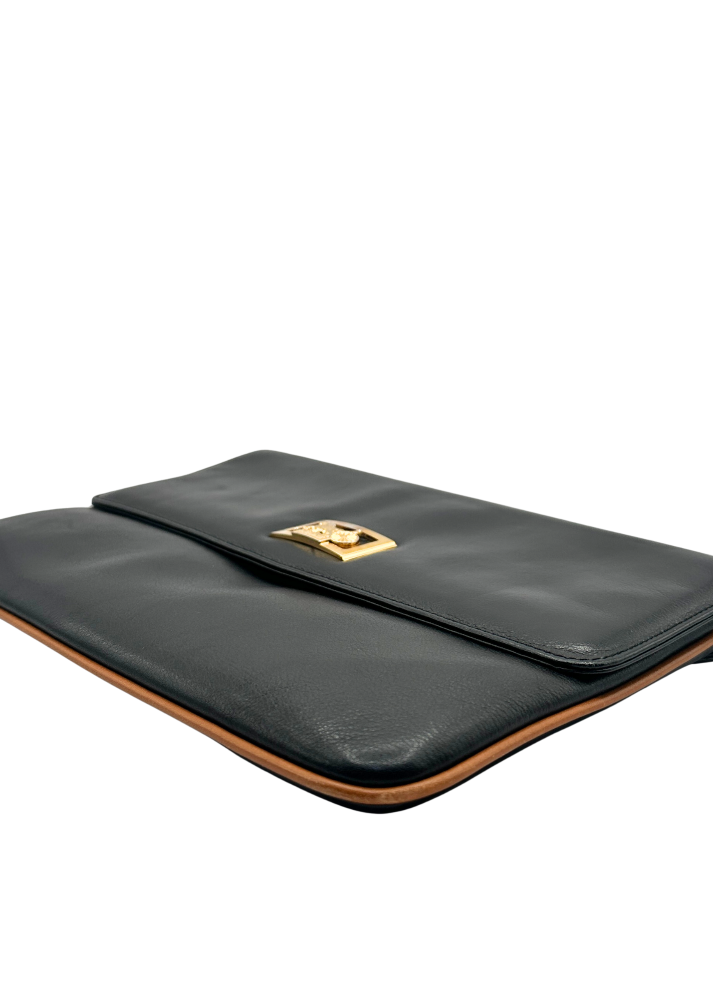 Black leather Celine clutch bag with gold clasp on a white background