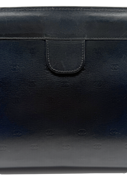 Black vintage lambskin leather Chanel clutch bag with brand logo on a white background