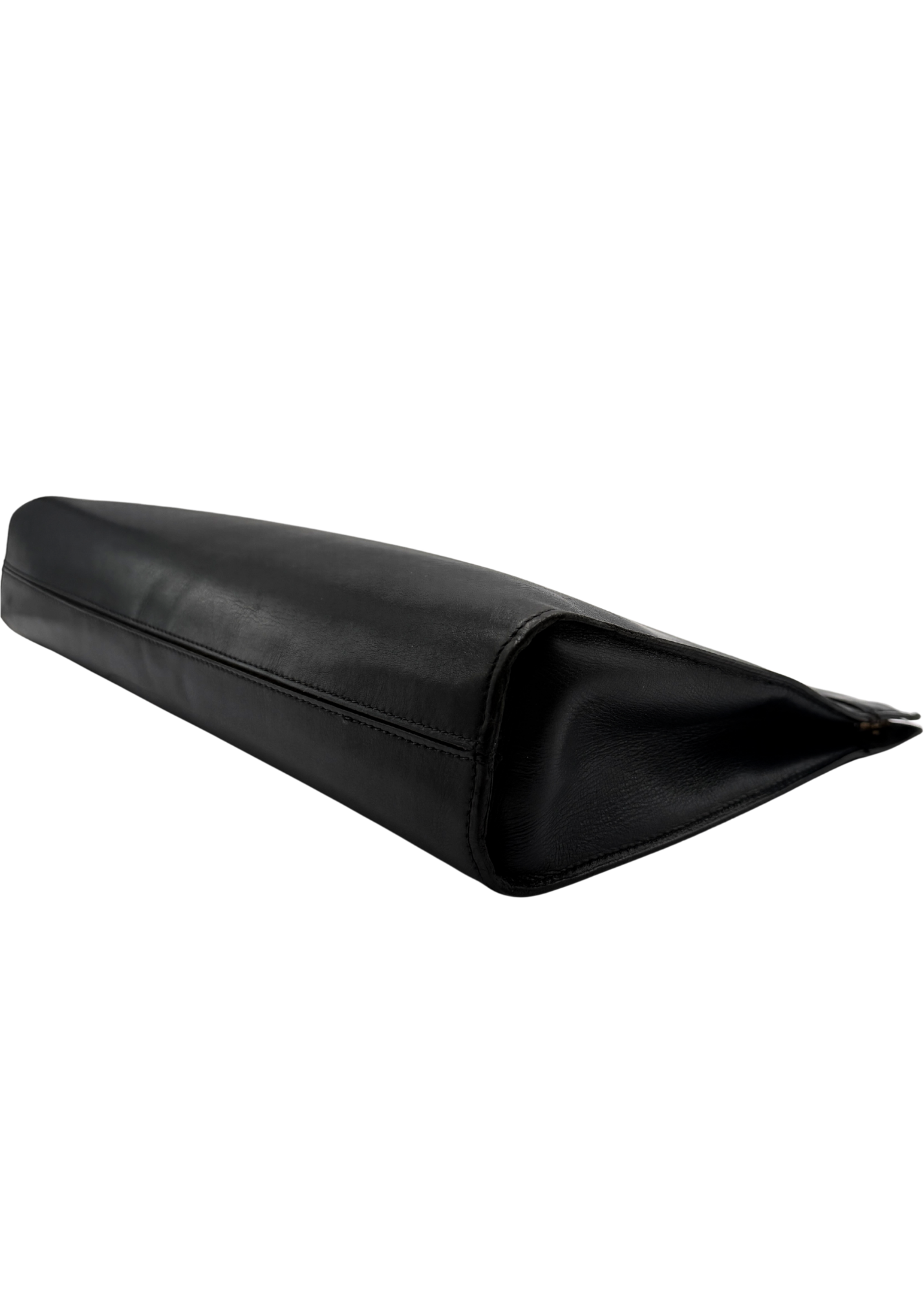 Vintage black lambskin leather Chanel clutch on white background