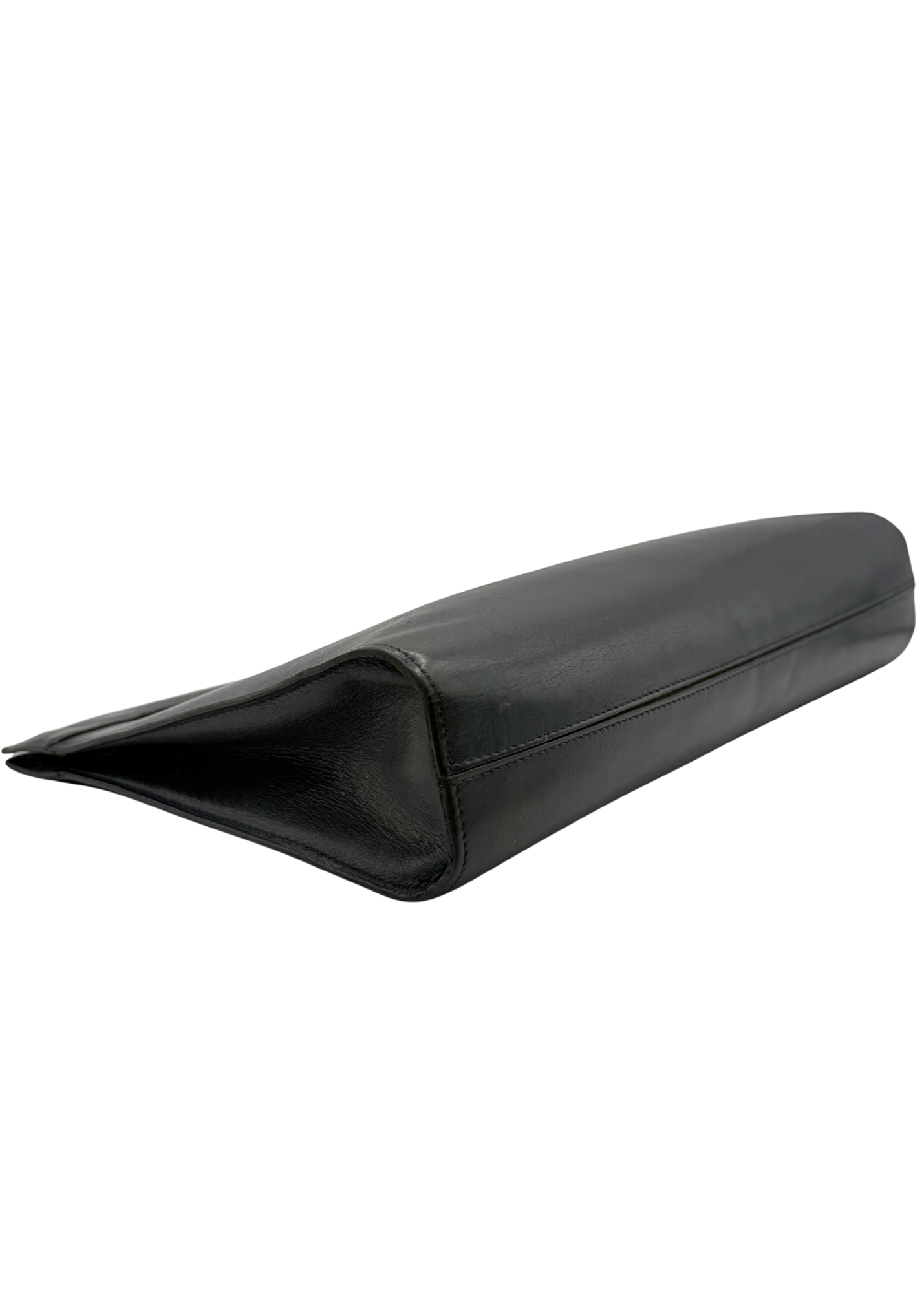 Black vintage lambskin leather Chanel clutch bag on a white background