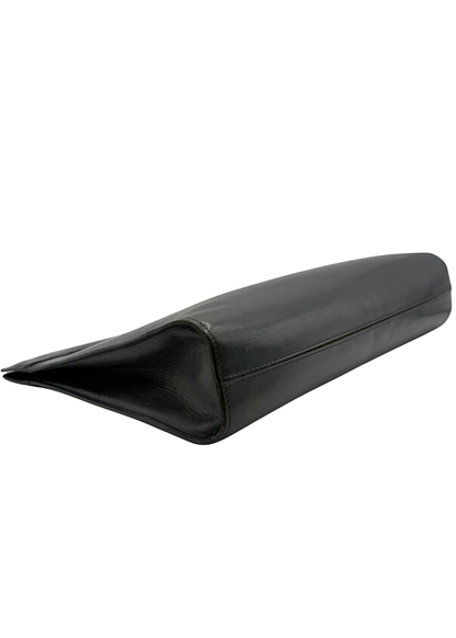 Black vintage lambskin leather Chanel clutch bag on a white background