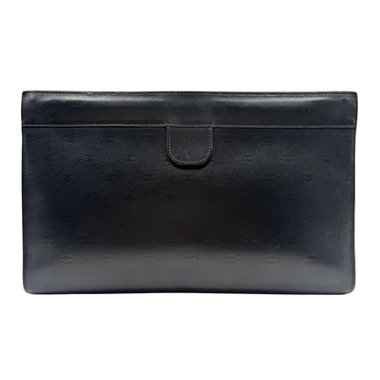 Black vintage lambskin leather Chanel clutch bag on a white background