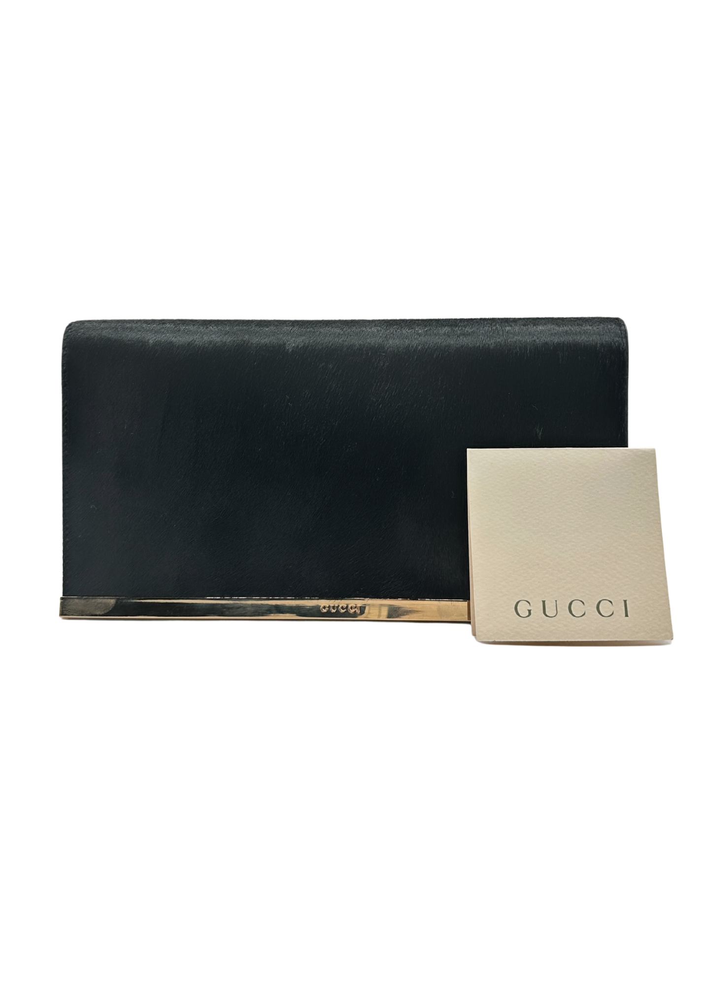 Black Gucci clutch with a matching cardholder on a white background