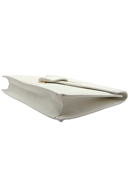 White vintage Yves Saint Laurent clutch bag on a white background