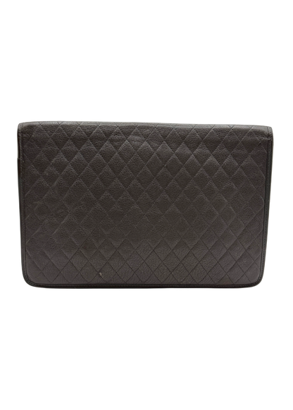 Back of a taupe vintage quilted YSL clutch bag on a white background