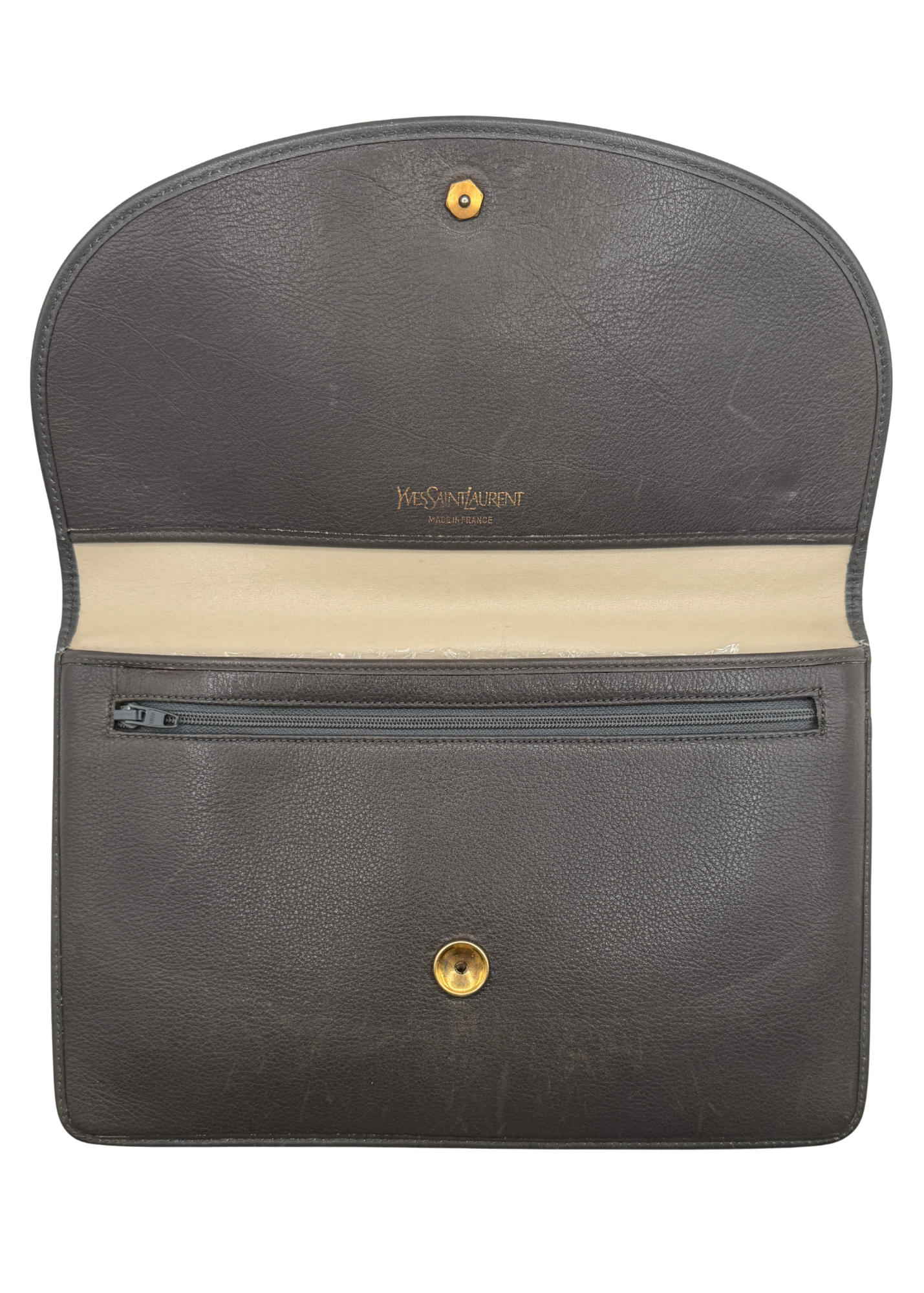 A vintage chocolate taupe leather clutch that is open showing the interior pouch and zipper