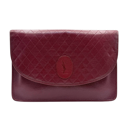 Vintage Yves Saint Laurent burgundy red quilted leather clutch against white background