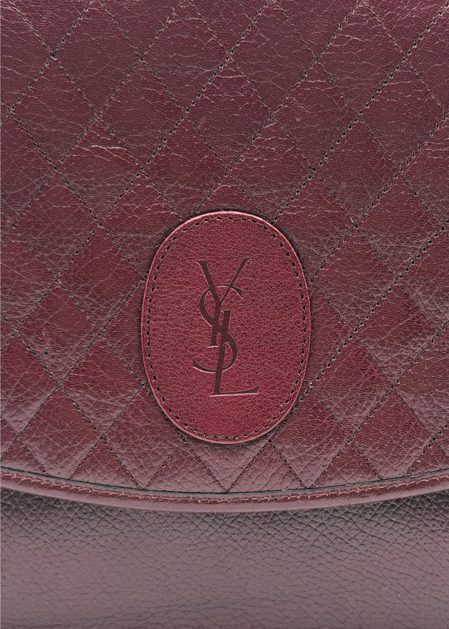Close up of vintage Yves Saint Laurent quilted leather clutch