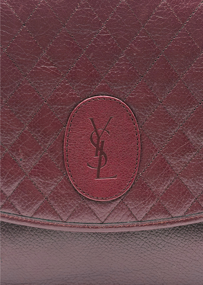Close up of vintage Yves Saint Laurent quilted leather clutch