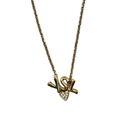 Gold YSL necklace with a heart-shaped pendant on a white background