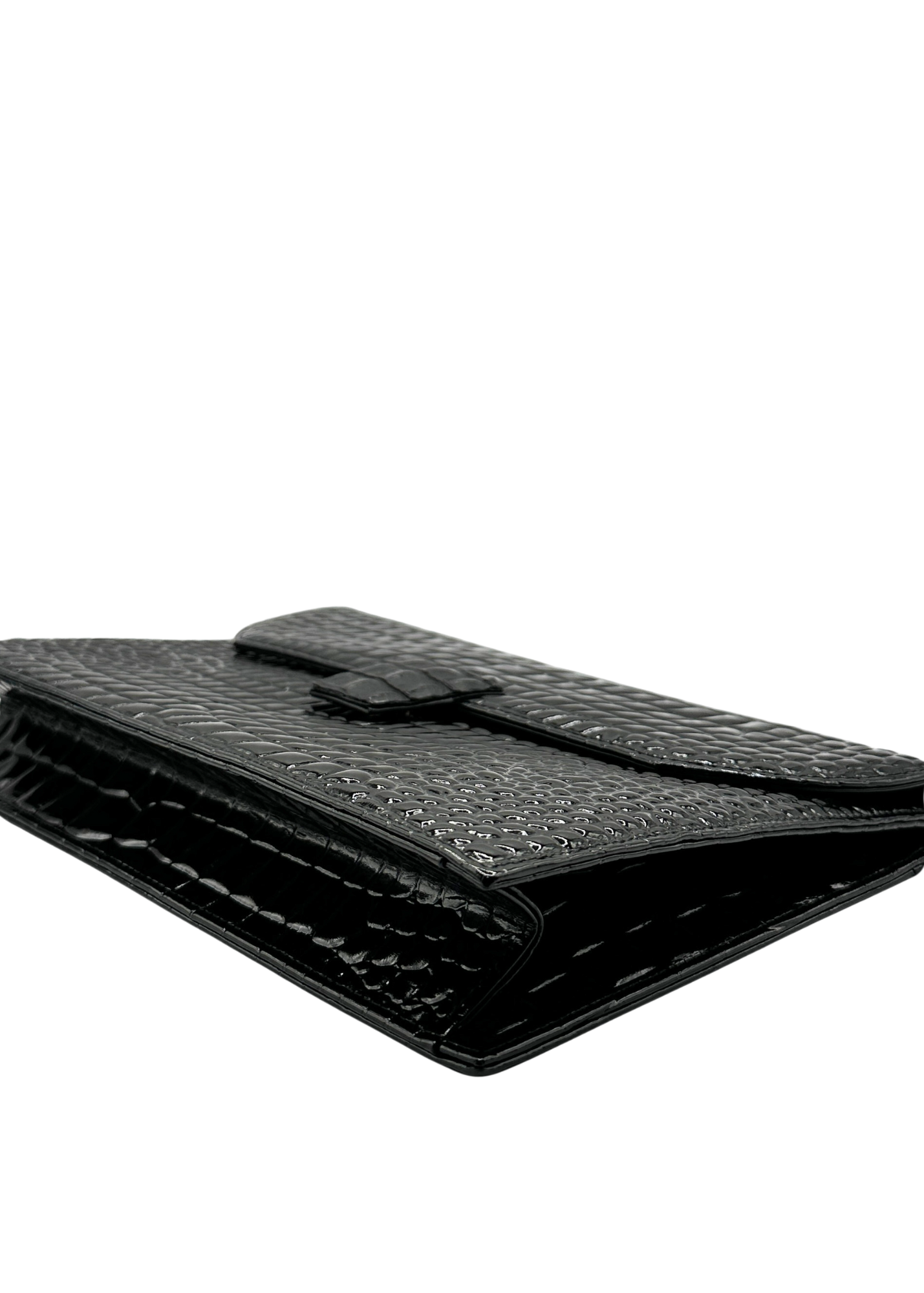 Black YSL crocodile-patterned clutch bag on a white background