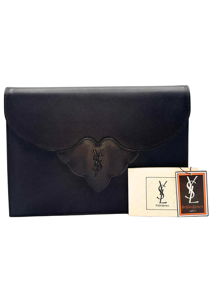 Brown leather clutch with Yves Saint Laurent logo and tags on a white background